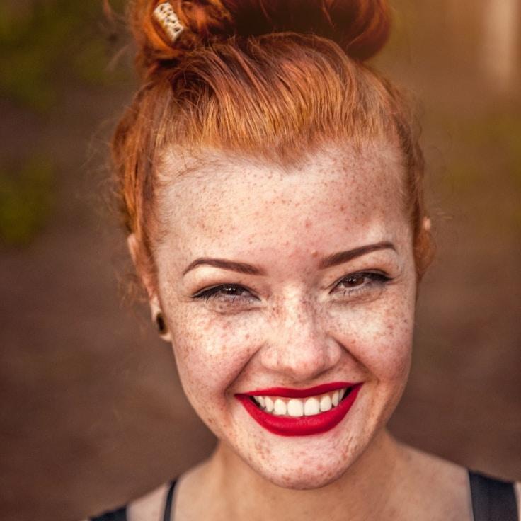Kaveri Mehta, Lead Design Curator at Tranquil Mountain Association, reviewing corporate floral arrangements